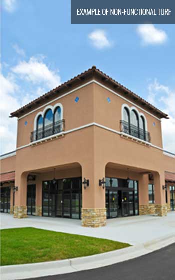 Photo of example-of-non-functional-turf, outdoor retail building with grass next to walkway for decoration